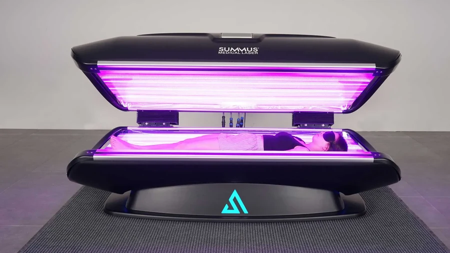 The Summus Vita full-body red light therapy bed, open with all five wavelengths running