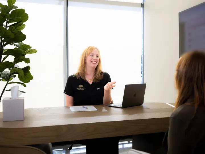 Our certified nutritionist walking a patient through her nutrition plan at the clinic