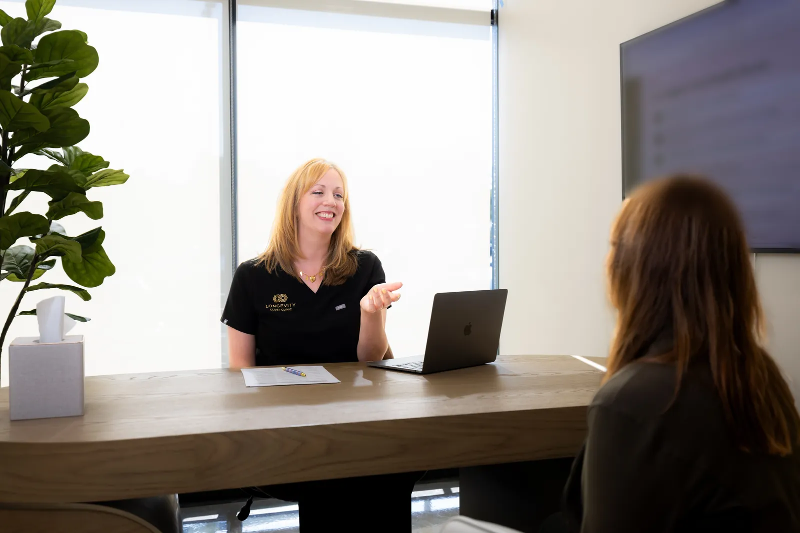Our certified nutritionist reviewing a patient's food plan